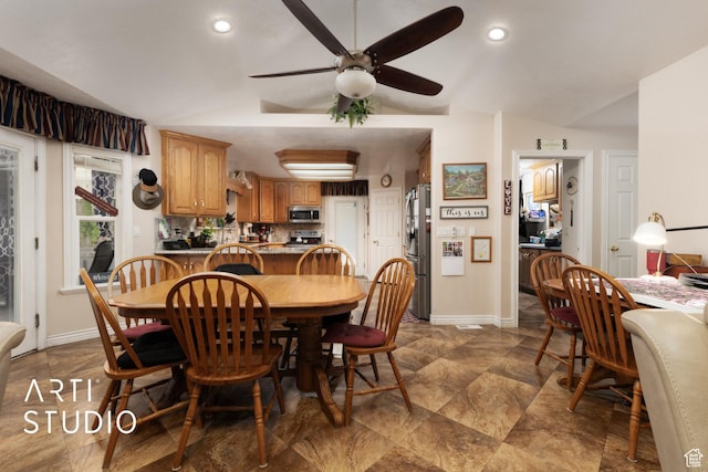 dining space with lofted ceiling, baseboards, recessed lighting, and a ceiling fan
