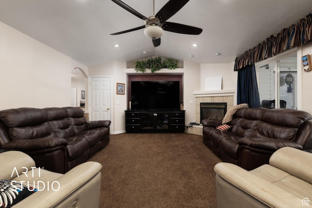 living area with lofted ceiling, a ceiling fan, dark carpet, and recessed lighting