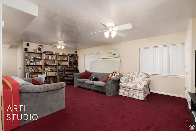 carpeted living room with ceiling fan and a textured ceiling