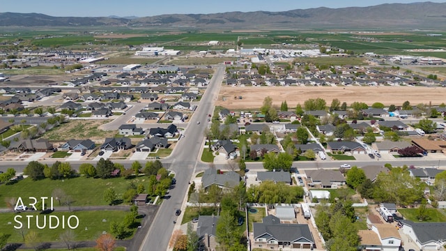 aerial view featuring a mountain view and a residential view