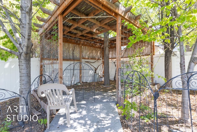 view of patio featuring fence