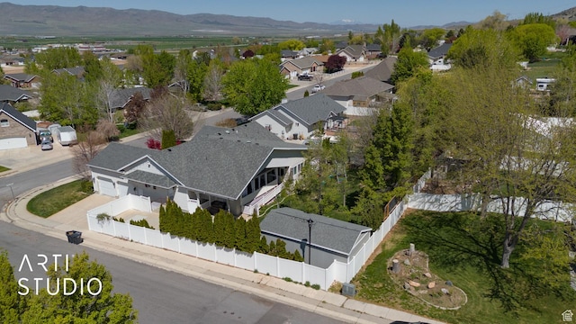 birds eye view of property with a mountain view and a residential view