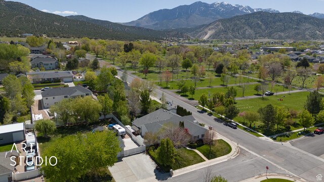 birds eye view of property with a mountain view and a residential view