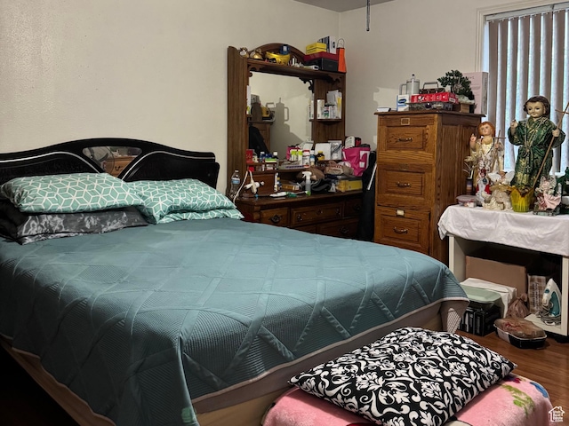 bedroom with wood finished floors