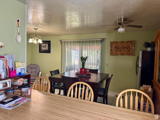 6367 W 4180 S, West Valley City, UT 84128 - dining space with ceiling fan, a chandelier, tile patterned flooring, a textured ceiling, and baseboards