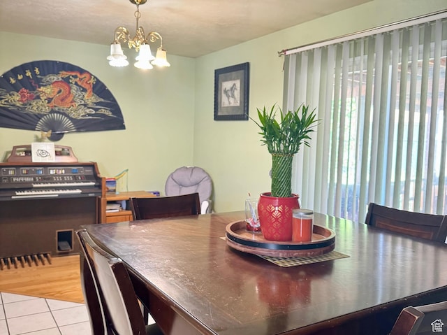 6367 W 4180 S, West Valley City, UT 84128 - dining space with tile patterned floors and a chandelier