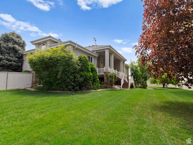 view of property exterior featuring stucco siding and stairway