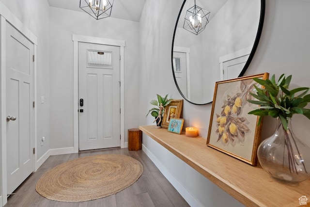 151 N 410th St S, Vineyard, UT 84059 - entryway with a chandelier, wood finished floors, and baseboards