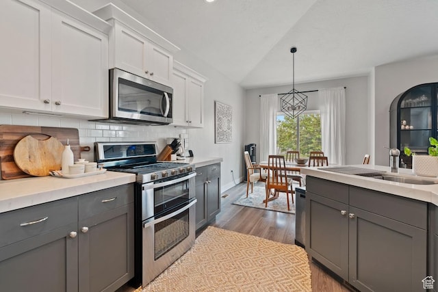 151 N 410th St S, Vineyard, UT 84059 - kitchen featuring stainless steel appliances, gray cabinets, wood finished floors, light countertops, and white cabinets