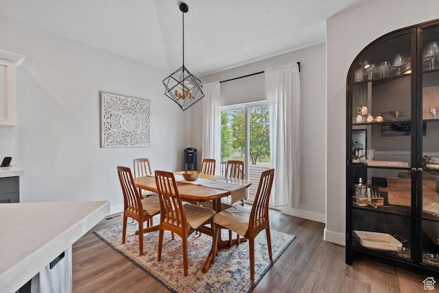 151 N 410th St S, Vineyard, UT 84059 - dining area with wood finished floors, a chandelier, and baseboards