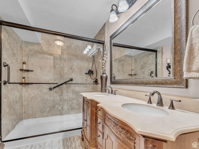 4760 S Meadow Creek Ln E, Ogden, UT 84403 - bathroom with a shower stall, double vanity, and a textured ceiling