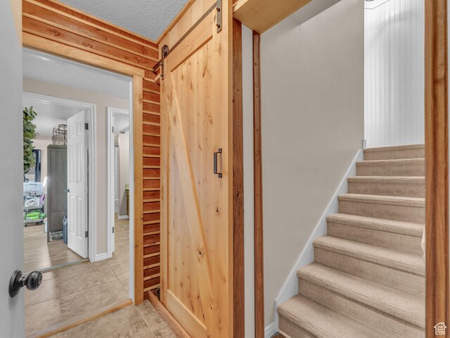 4760 S Meadow Creek Ln E, Ogden, UT 84403 - staircase with tile patterned flooring