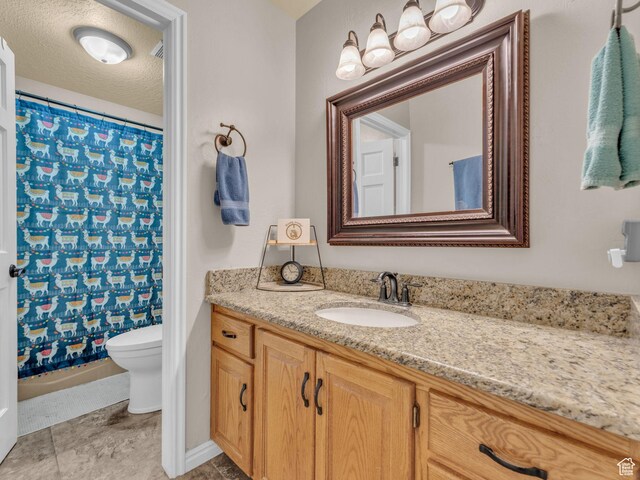 4760 S Meadow Creek Ln E, Ogden, UT 84403 - full bathroom featuring vanity, toilet, and baseboards