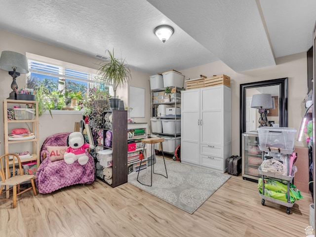 4760 S Meadow Creek Ln E, Ogden, UT 84403 - office with light wood-style floors and a textured ceiling