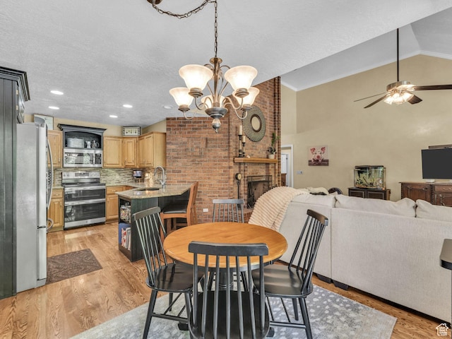 4760 S Meadow Creek Ln E, Ogden, UT 84403 - dining space featuring light wood finished floors, a chandelier, lofted ceiling, a textured ceiling, and ceiling fan