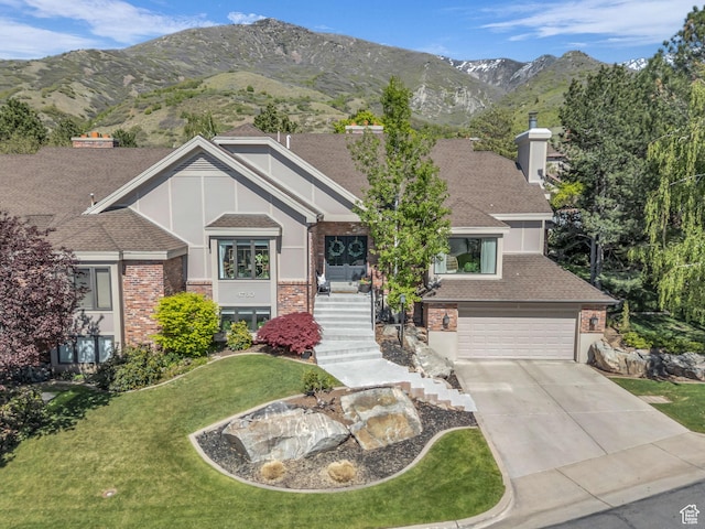 4760 S Meadow Creek Ln E, Ogden, UT 84403 - view of front of property featuring driveway, a front yard, brick siding, a garage, and roof with shingles