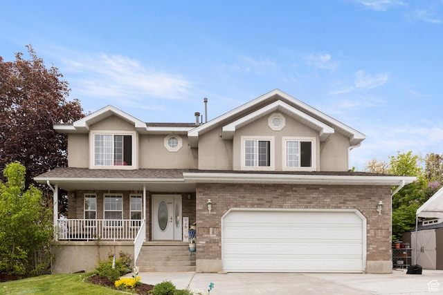 traditional-style house with covered porch, an attached garage, stucco siding, driveway, and brick siding