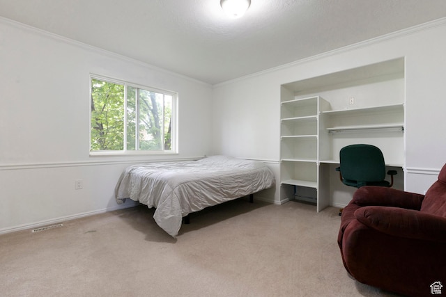 bedroom featuring ornamental molding, carpet floors, and baseboards