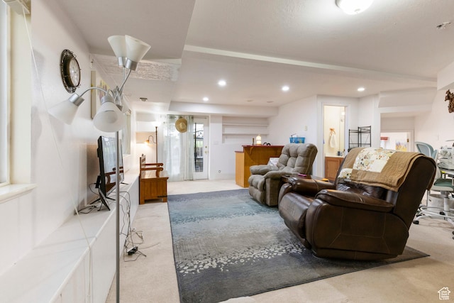 living area with carpet floors and recessed lighting