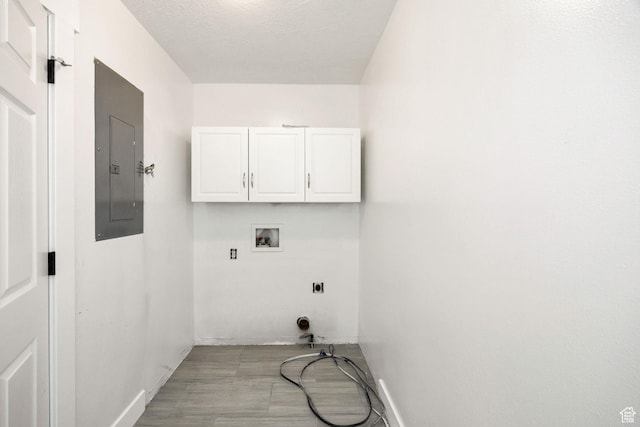 739 N 500 E, Logan, UT 84321 - laundry area with cabinet space, electric panel, washer hookup, and baseboards