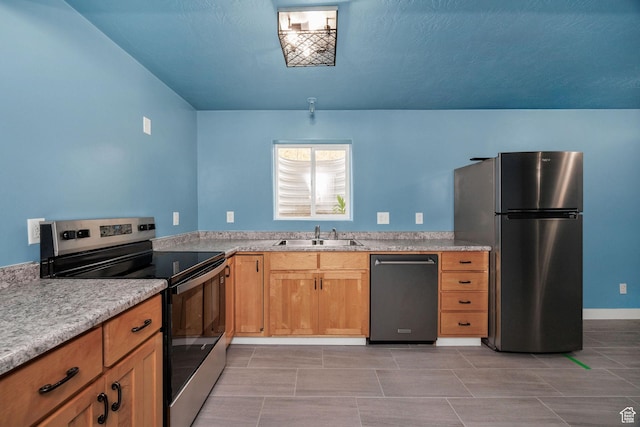739 N 500 E, Logan, UT 84321 - kitchen with appliances with stainless steel finishes, a sink, and light countertops