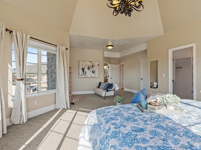 carpeted bedroom with high vaulted ceiling, a chandelier, and baseboards