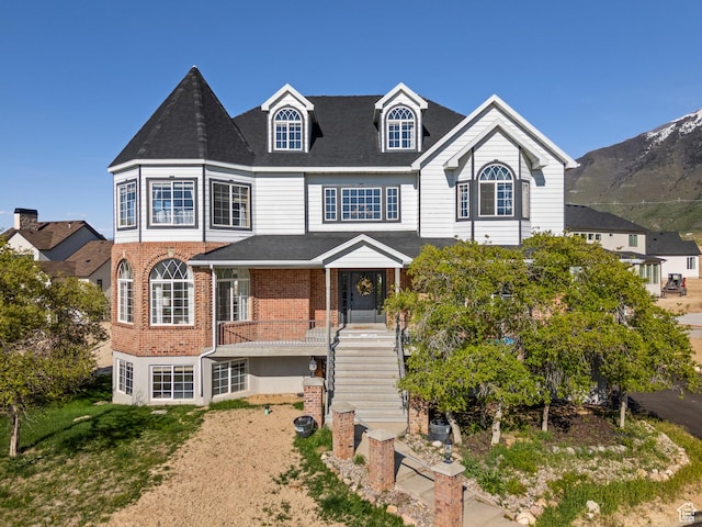 view of front of home featuring brick siding