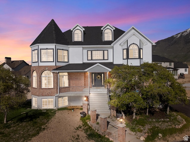 view of front of property with brick siding and a porch