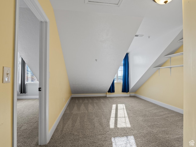 bonus room with carpet flooring, baseboards, and lofted ceiling