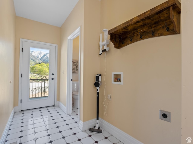laundry room with electric dryer hookup, light flooring, washer hookup, and baseboards