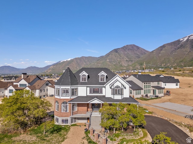 view of front of house featuring a mountain view and stairs