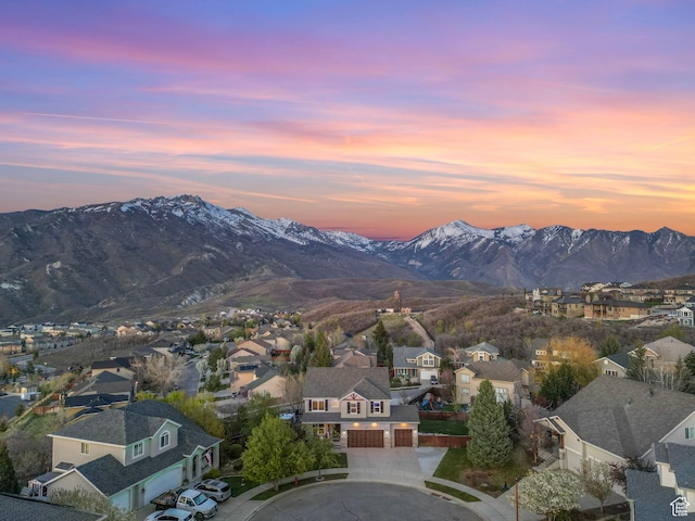 view of mountain background featuring nearby suburban area