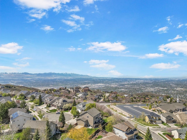 aerial view of residential area featuring a mountainous background