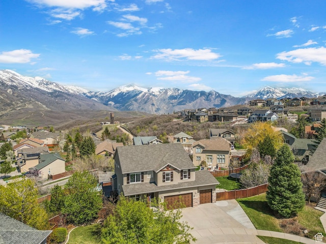 view of mountain background featuring nearby suburban area