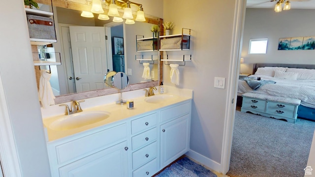bathroom featuring double vanity and ensuite bath