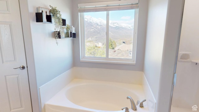 bathroom with a garden tub