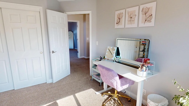 carpeted office space with baseboards