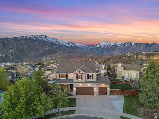 view of mountain background featuring nearby suburban area