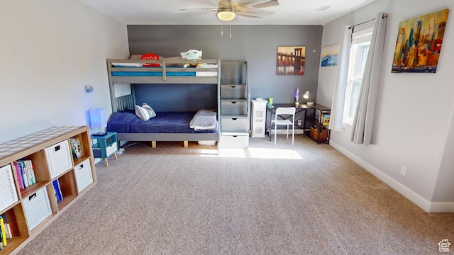 bedroom featuring carpet, baseboards, and ceiling fan