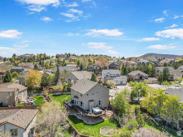 aerial perspective of suburban area with a mountainous background