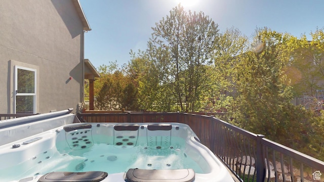 wooden terrace with a hot tub
