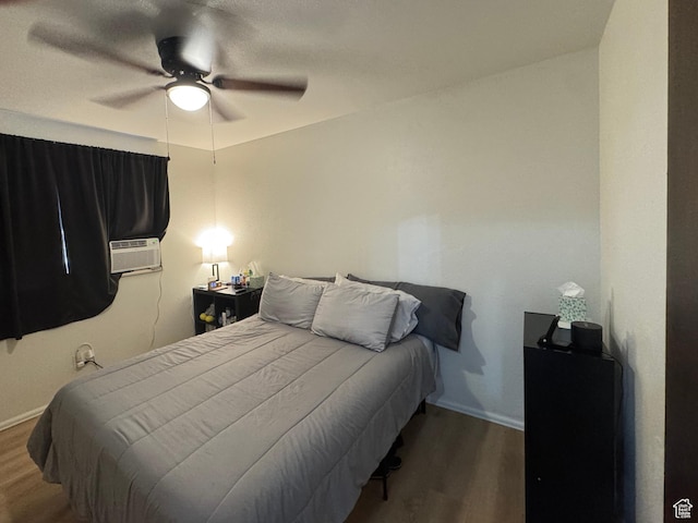 527 W Palisade Dr, Moab, UT 84532 - bedroom featuring wood finished floors, ceiling fan, and cooling unit