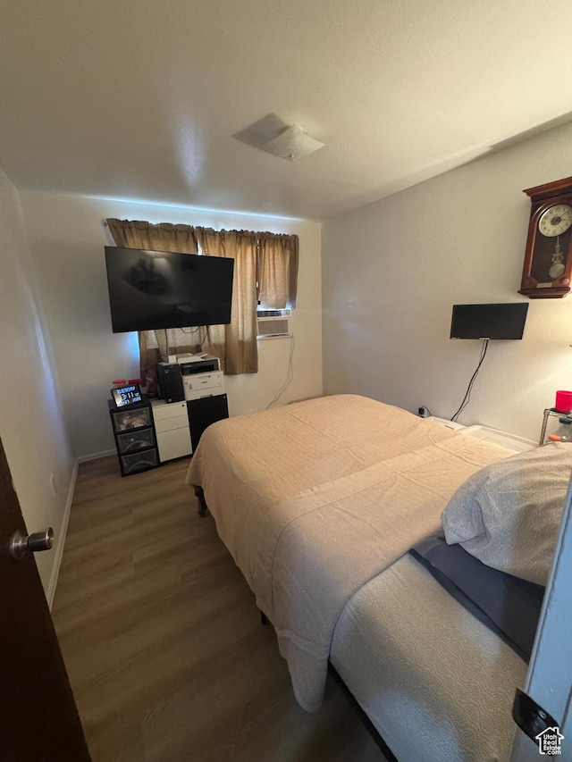 527 W Palisade Dr, Moab, UT 84532 - bedroom with wood finished floors and baseboards