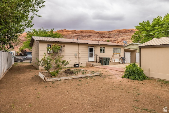527 W Palisade Dr, Moab, UT 84532 - rear view of property with a patio area, entry steps, metal roof, and a mountain view