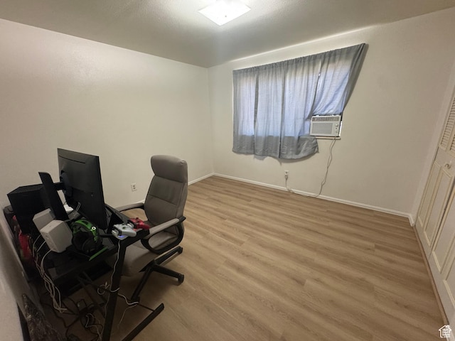 527 W Palisade Dr, Moab, UT 84532 - home office with light wood-style flooring and cooling unit