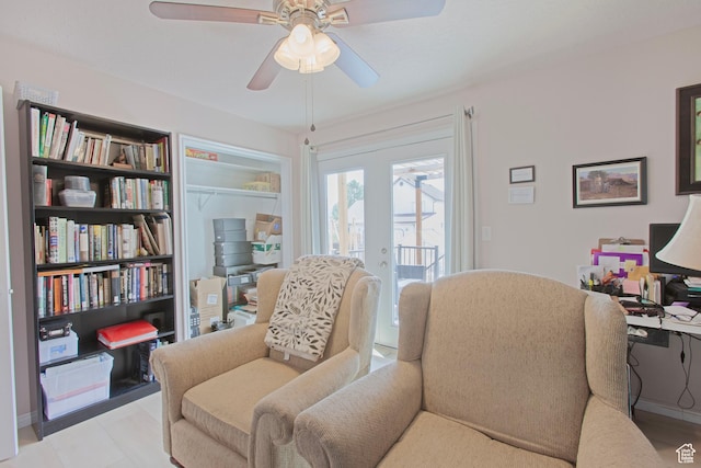 living area with a ceiling fan