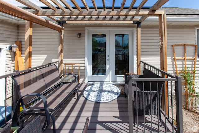 deck featuring a pergola and french doors