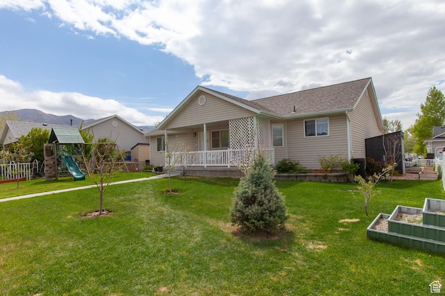 view of front of house featuring a playground, a porch, a garden, and a shingled roof