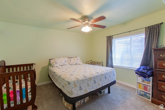 bedroom with carpet flooring, baseboards, and ceiling fan