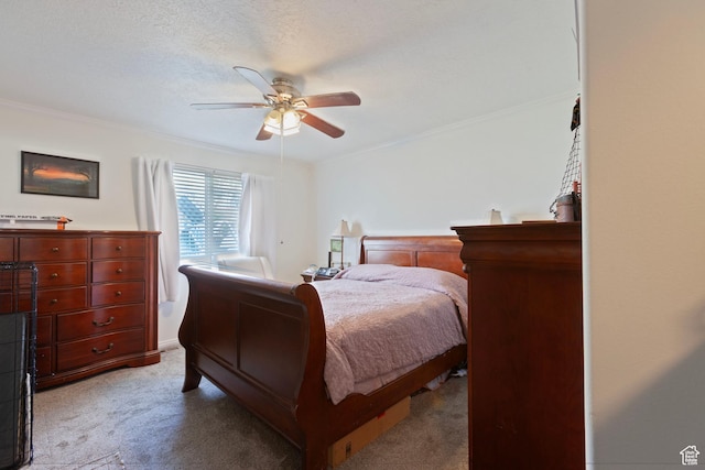bedroom with carpet flooring, crown molding, and a ceiling fan